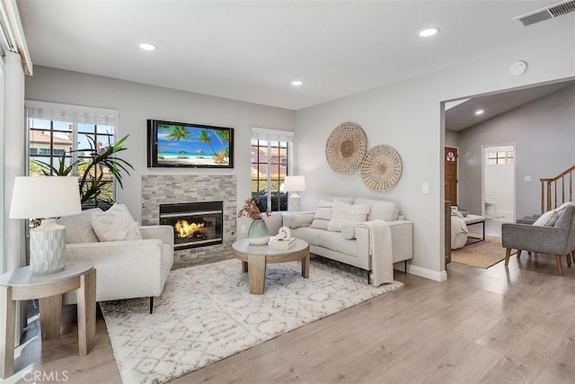12152 Napoli Dr, Cerritos, CA 90703 - living room featuring a tile fireplace, healthy amount of natural light, light wood-type flooring, and recessed lighting
