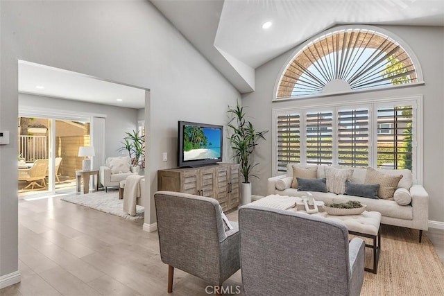 12152 Napoli Dr, Cerritos, CA 90703 - living area with wood finished floors, high vaulted ceiling, and recessed lighting