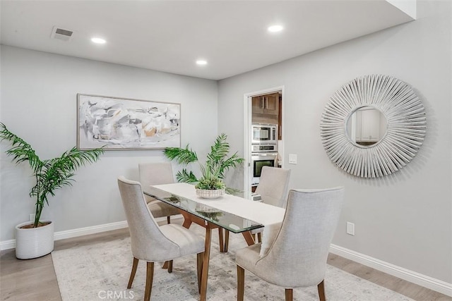 12152 Napoli Dr, Cerritos, CA 90703 - dining area with light wood-type flooring and recessed lighting