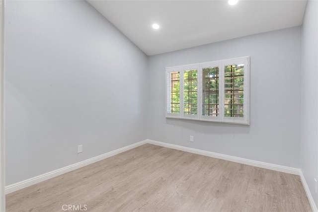 12152 Napoli Dr, Cerritos, CA 90703 - unfurnished room featuring wood finished floors, recessed lighting, and vaulted ceiling
