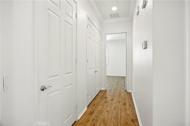 1740 Las Colinas Rd, Beaumont, CA 92223 - hallway with crown molding and light wood-style floors