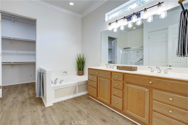 1740 Las Colinas Rd, Beaumont, CA 92223 - full bath featuring double vanity, a stall shower, wood finished floors, a bath, and crown molding