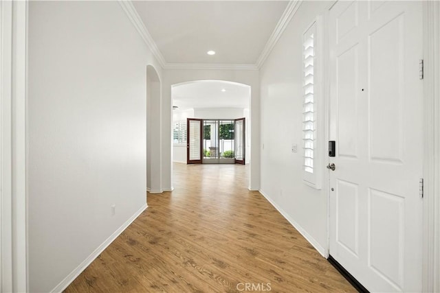 1740 Las Colinas Rd, Beaumont, CA 92223 - entryway featuring arched walkways, light wood-style flooring, crown molding, and recessed lighting