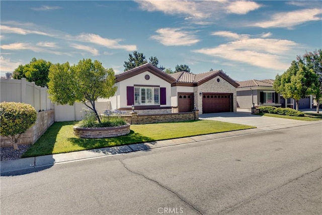 1740 Las Colinas Rd, Beaumont, CA 92223 - mediterranean / spanish-style house with an attached garage, stucco siding, concrete driveway, a tiled roof, and stone siding