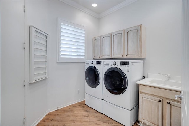 1740 Las Colinas Rd, Beaumont, CA 92223 - laundry area with washer and dryer, crown molding, cabinet space, and light wood-style flooring