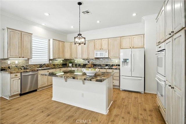 1740 Las Colinas Rd, Beaumont, CA 92223 - kitchen featuring stainless steel appliances, light brown cabinets, ornamental molding, backsplash, and a center island