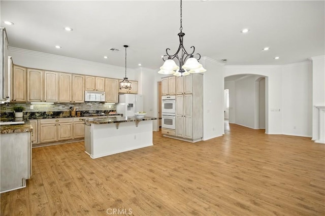 1740 Las Colinas Rd, Beaumont, CA 92223 - kitchen featuring white appliances, arched walkways, light brown cabinets, ornamental molding, and light wood-style floors