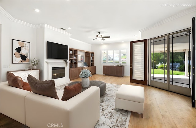 1740 Las Colinas Rd, Beaumont, CA 92223 - living room with ceiling fan, light wood-style flooring, crown molding, recessed lighting, and a glass covered fireplace
