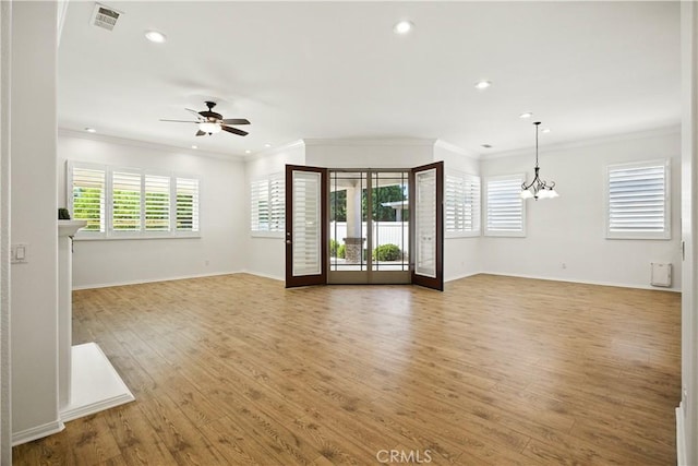 1740 Las Colinas Rd, Beaumont, CA 92223 - unfurnished living room featuring ceiling fan, recessed lighting, light wood-type flooring, a chandelier, and crown molding