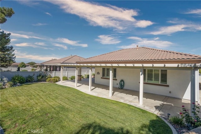 1740 Las Colinas Rd, Beaumont, CA 92223 - back of house featuring stucco siding, a tile roof, and a patio area