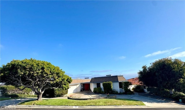 129 Monarch Bay Dr, Dana Point, CA 92629 - view of front facade with driveway and a front yard
