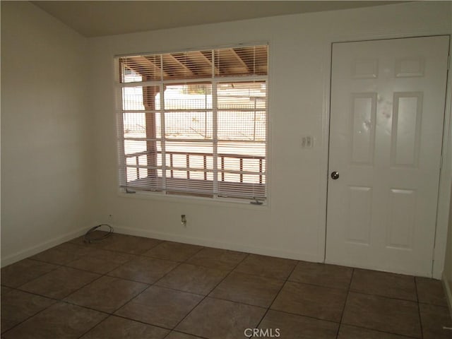 201 W Williams St, Barstow, CA 92311 - tiled spare room with baseboards