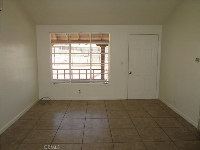 201 W Williams St, Barstow, CA 92311 - tiled empty room with baseboards