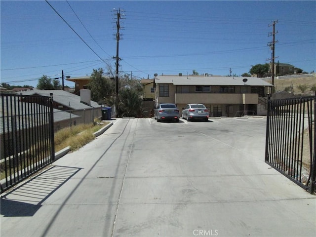 201 W Williams St, Barstow, CA 92311 - view of concrete driveway featuring a gated entry