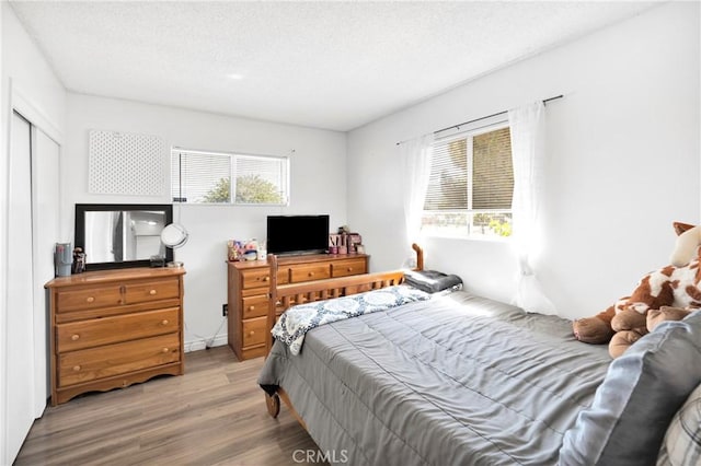 10000 8th Ave, Hesperia, CA 92345 - bedroom featuring wood finished floors and a textured ceiling
