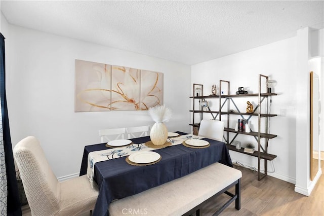 10000 8th Ave, Hesperia, CA 92345 - dining space featuring wood finished floors and a textured ceiling
