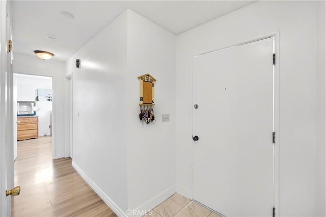 10000 8th Ave, Hesperia, CA 92345 - foyer entrance featuring baseboards and light wood-style floors