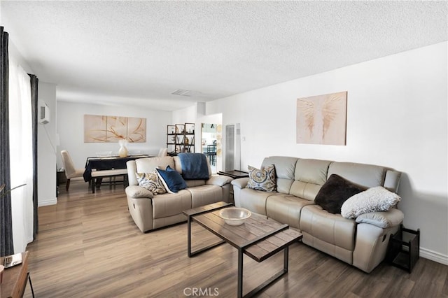 10000 8th Ave, Hesperia, CA 92345 - living room featuring a textured ceiling and wood finished floors