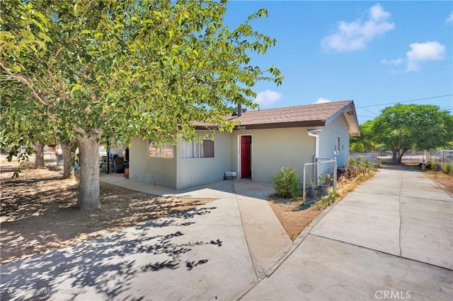 10000 8th Ave, Hesperia, CA 92345 - ranch-style home with stucco siding and a patio