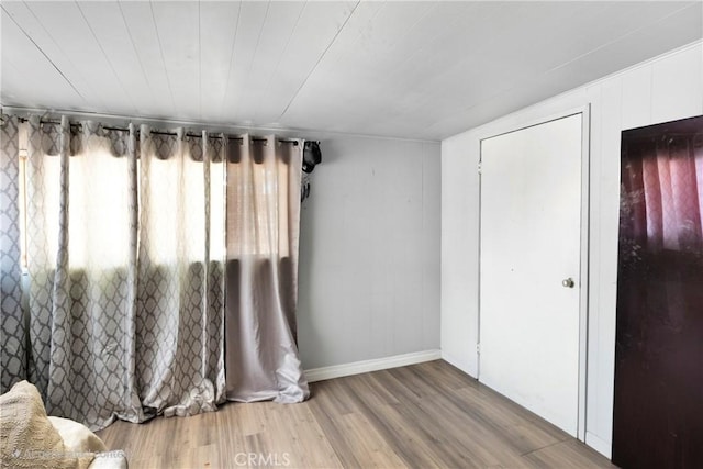 10000 8th Ave, Hesperia, CA 92345 - unfurnished bedroom featuring wood finished floors and baseboards