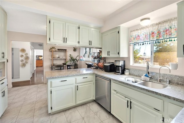 10000 8th Ave, Hesperia, CA 92345 - kitchen with stainless steel dishwasher, a peninsula, plenty of natural light, and white cabinets