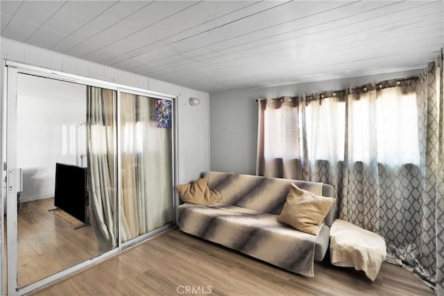 10000 8th Ave, Hesperia, CA 92345 - living area with healthy amount of natural light, wood finished floors, and wooden ceiling