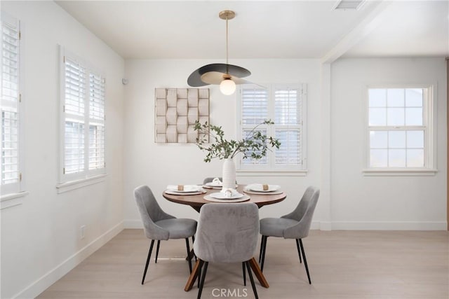13203 Lakewood Blvd, Downey, CA 90242 - dining room featuring light wood-type flooring, healthy amount of natural light, and a ceiling fan