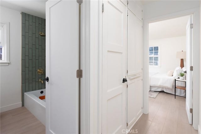 13203 Lakewood Blvd, Downey, CA 90242 - ensuite bathroom with wood finished floors and tub / shower combination