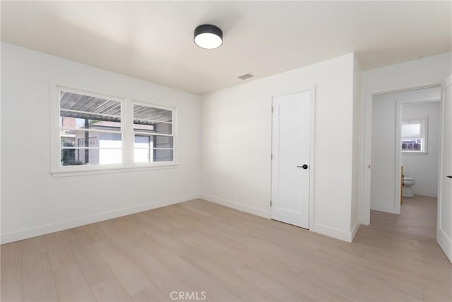 13203 Lakewood Blvd, Downey, CA 90242 - unfurnished bedroom with light wood-style floors and baseboards