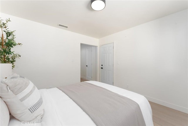 13203 Lakewood Blvd, Downey, CA 90242 - bedroom with light wood finished floors and baseboards