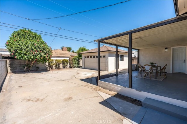 13203 Lakewood Blvd, Downey, CA 90242 - view of patio / terrace with an outbuilding and a garage