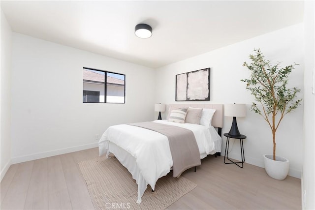 13203 Lakewood Blvd, Downey, CA 90242 - bedroom with light wood-style floors and baseboards