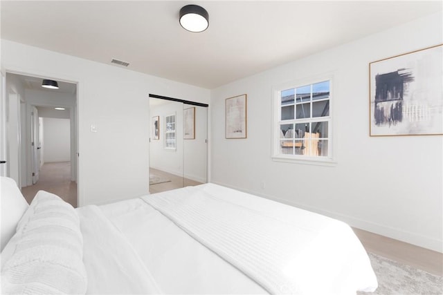 13203 Lakewood Blvd, Downey, CA 90242 - bedroom with light wood-type flooring and a closet