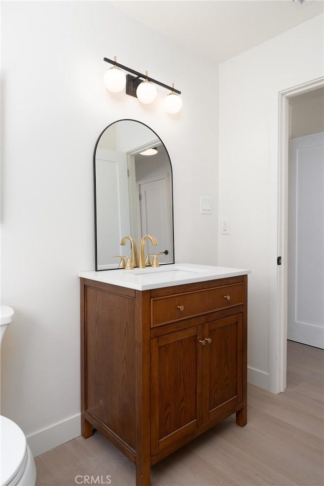 13203 Lakewood Blvd, Downey, CA 90242 - bathroom featuring vanity and wood finished floors