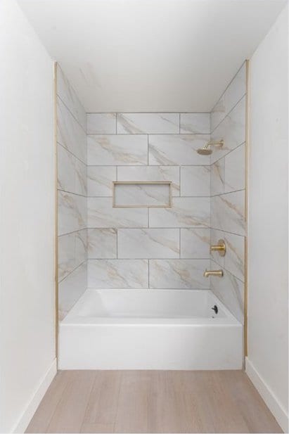 13203 Lakewood Blvd, Downey, CA 90242 - bathroom featuring wood finished floors and washtub / shower combination