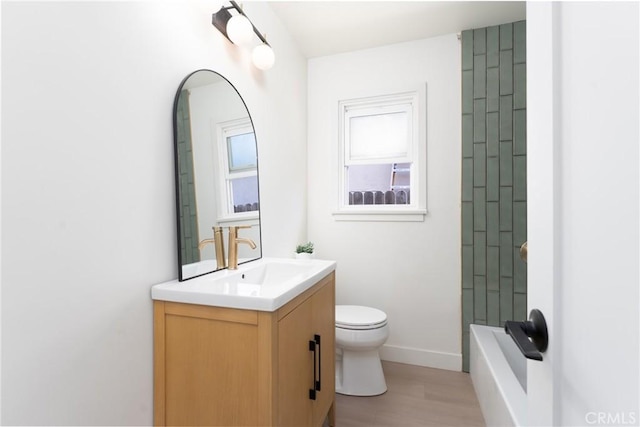 13203 Lakewood Blvd, Downey, CA 90242 - full bath featuring vanity, wood finished floors, and washtub / shower combination