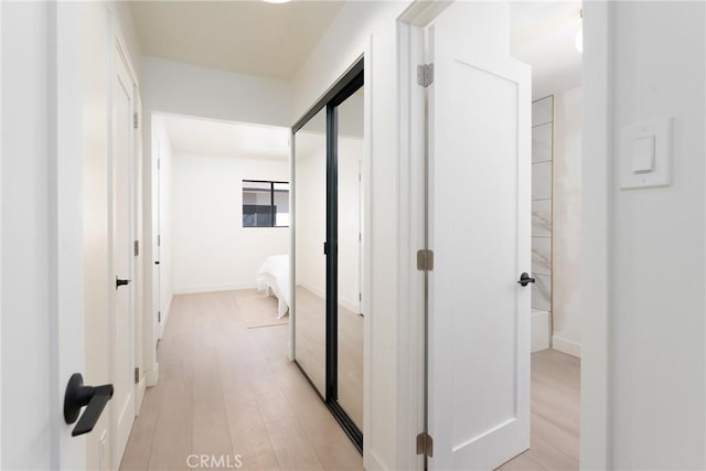13203 Lakewood Blvd, Downey, CA 90242 - hallway with light wood-style flooring and baseboards