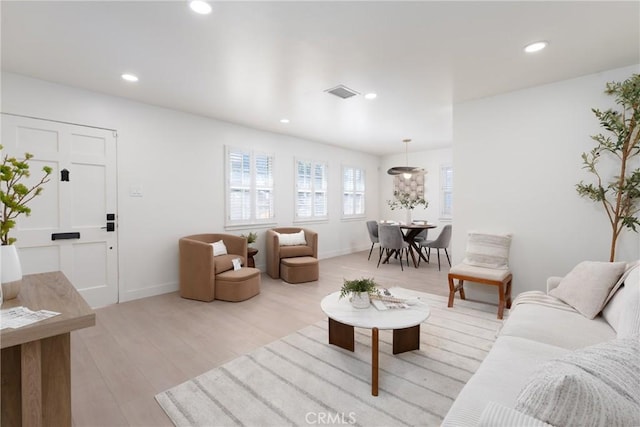 13203 Lakewood Blvd, Downey, CA 90242 - living room featuring light wood-style flooring and recessed lighting