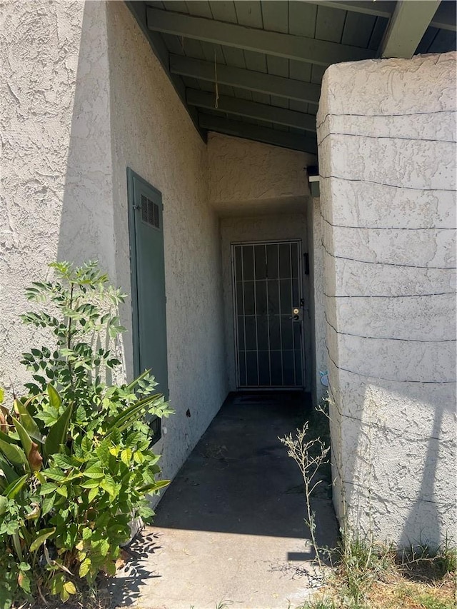 946 W Woodcrest, Bloomington, CA 92316 - property entrance with stucco siding