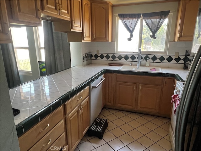 946 W Woodcrest, Bloomington, CA 92316 - kitchen featuring tile countertops, dishwasher, tasteful backsplash, light tile patterned flooring, and range