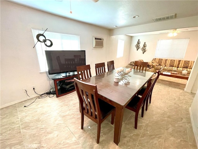 1325 Norton Ave, Dos Palos, CA 93620 - dining room with a ceiling fan and a wall mounted AC