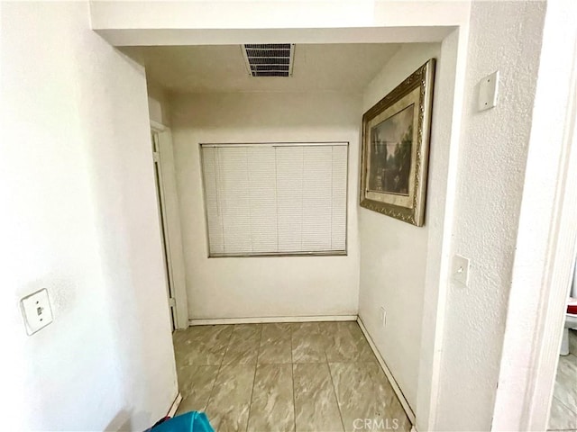 1325 Norton Ave, Dos Palos, CA 93620 - hallway featuring baseboards