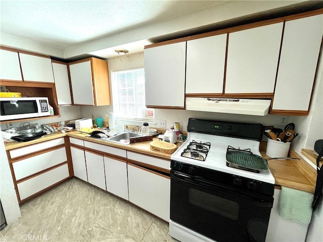 1325 Norton Ave, Dos Palos, CA 93620 - kitchen with white appliances, ventilation hood, light countertops, white cabinets, and a textured ceiling