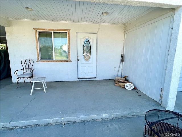 1325 Norton Ave, Dos Palos, CA 93620 - property entrance featuring stucco siding
