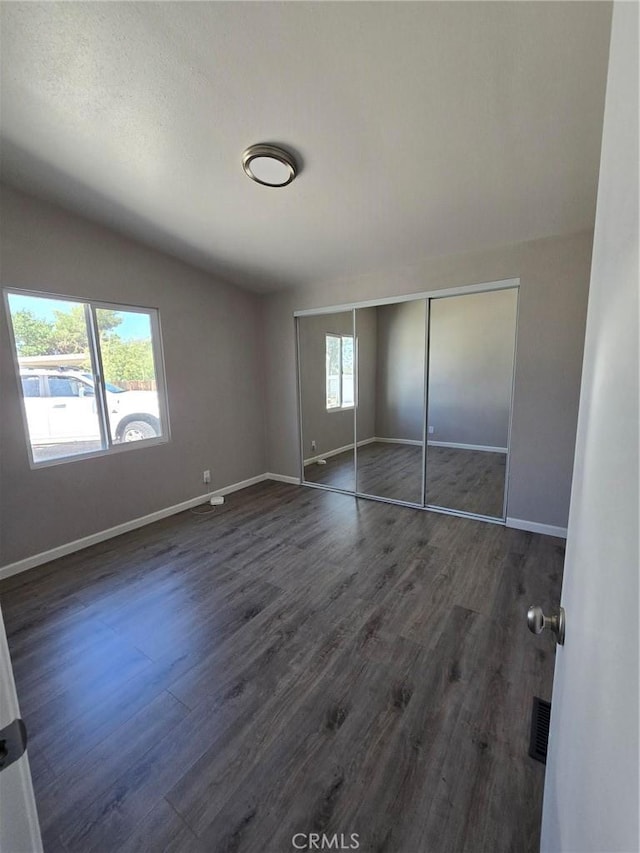18812 Arbor Ct, Adelanto, CA 92301 - unfurnished bedroom with dark wood-style floors and a closet