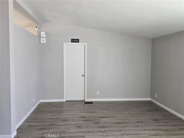 18812 Arbor Ct, Adelanto, CA 92301 - empty room with wood finished floors and vaulted ceiling
