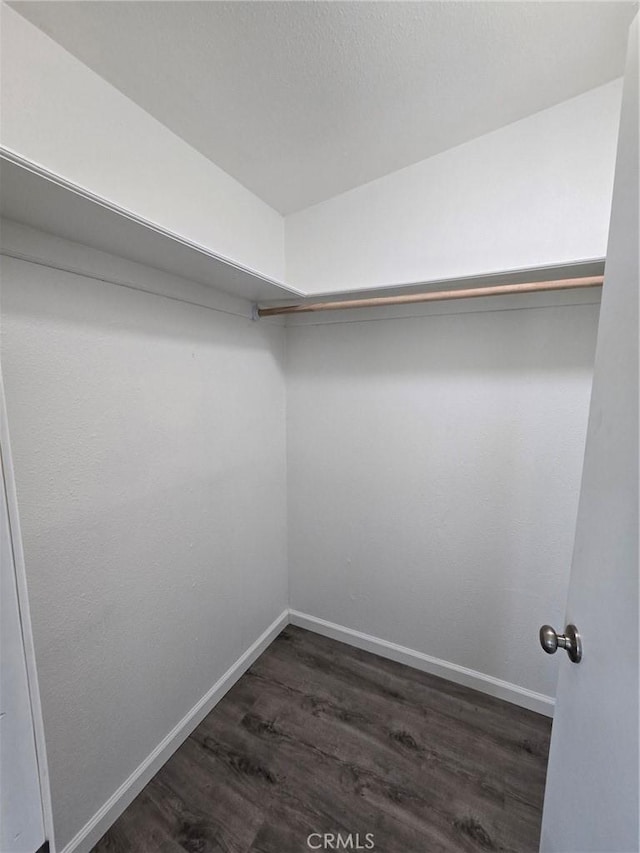 18812 Arbor Ct, Adelanto, CA 92301 - spacious closet featuring dark wood-style flooring