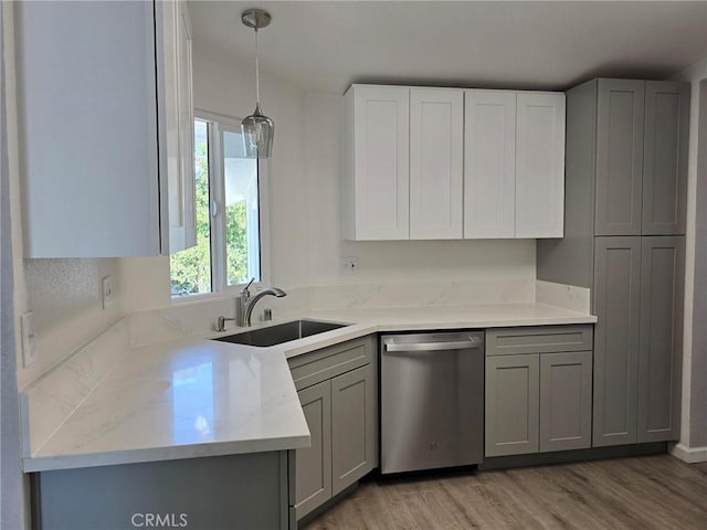 18812 Arbor Ct, Adelanto, CA 92301 - kitchen featuring dishwasher, gray cabinetry, light wood finished floors, light countertops, and pendant lighting