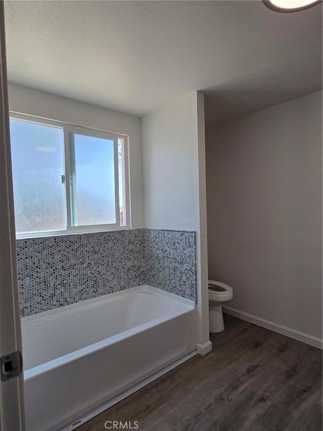 18812 Arbor Ct, Adelanto, CA 92301 - full bathroom with a bath, wood finished floors, and a textured ceiling