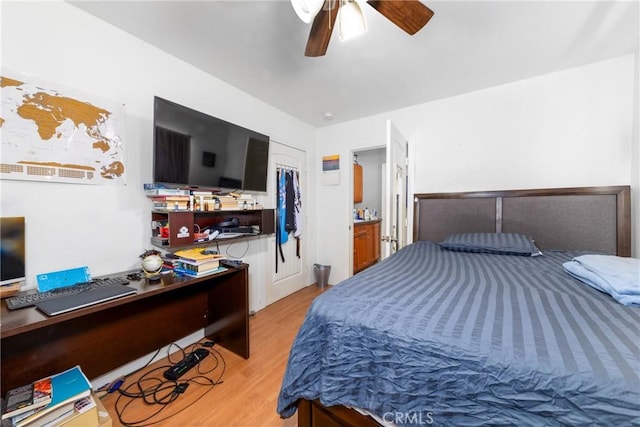 795 E 42nd Pl, Los Angeles, CA 90011 - bedroom with light wood-style flooring, an office area, ceiling fan, and a closet